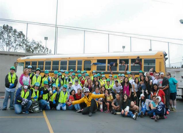 Large group in front of bus