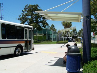 View of DowneyLINK Bus and Depot Bus Stop with the Downey Depot in the background