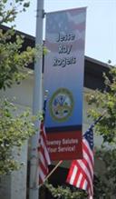 A banner attached to a streetlamp